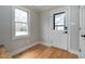 Mud room with natural lighting through a window and an exterior door with glass insert at 112 Hartland Ct, Raleigh, NC 27614