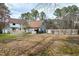 The rear exterior of the home features a lovely new back deck and in-ground pool at 112 Hartland Ct, Raleigh, NC 27614