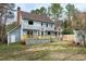 The rear exterior of the home features a lovely new back deck overlooking the yard at 112 Hartland Ct, Raleigh, NC 27614