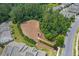 Aerial view of dog park surrounded by homes and lush greenery at 114 Mt Evans Dr, Durham, NC 27705