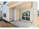 A view of a home's back patio with gray concrete and a sliding glass door at 114 Mt Evans Dr, Durham, NC 27705