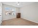 Bedroom with neutral color scheme, carpet floors, and a large window at 114 Mt Evans Dr, Durham, NC 27705