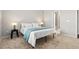 Comfortable bedroom features carpet floors, a bed with a blue blanket, and neutral paint at 114 Mt Evans Dr, Durham, NC 27705