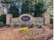 Thompson Ridge community brick sign featuring lush landscaping and greenery at 114 Mt Evans Dr, Durham, NC 27705