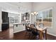 Dining area featuring hardwood floors and natural light, flowing into the kitchen at 114 Mt Evans Dr, Durham, NC 27705