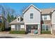 Charming townhome exterior with stone accents and a well-maintained landscaped yard at 114 Mt Evans Dr, Durham, NC 27705