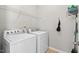 Well-equipped laundry room features a modern washer, dryer, and ample storage space at 114 Mt Evans Dr, Durham, NC 27705