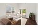 Bright living room with a sliding door leading to a private backyard at 114 Mt Evans Dr, Durham, NC 27705