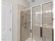 Shower with tiled walls, glass door, and shower head at 114 Mt Evans Dr, Durham, NC 27705