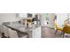 Charming kitchen featuring a granite island, stainless steel appliances, and a view of the dining area at 123 Holmes Corner Dr, Smithfield, NC 27577