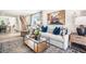 Cozy living room with an area rug, modern furniture, and open layout to dining area at 123 Holmes Corner Dr, Smithfield, NC 27577