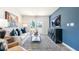 Stylish living room features modern decor, a sleek entertainment center, and an abundance of natural light at 123 Holmes Corner Dr, Smithfield, NC 27577
