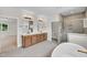 Large bathroom with double sinks, a separate shower, and a luxurious soaking tub at 12912 Grey Willow Dr, Raleigh, NC 27613