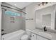 Well-lit bathroom showcases a bathtub, shower, and vanity with modern fixtures at 12912 Grey Willow Dr, Raleigh, NC 27613