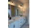Elegant bathroom with double vanity, large mirrors, and stylish lighting, creating a luxurious feel at 12912 Grey Willow Dr, Raleigh, NC 27613