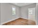 Hardwood floored bedroom featuring a well lit space with windows and natural light at 12912 Grey Willow Dr, Raleigh, NC 27613