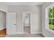 Bedroom with neutral carpet and trim and a window offering lots of natural light at 12912 Grey Willow Dr, Raleigh, NC 27613