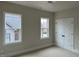 Comfortable bedroom with double door closet and bright windows, offering storage and natural light at 12912 Grey Willow Dr, Raleigh, NC 27613