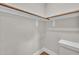 Shot of a bedroom walk-in closet featuring shelving and ample storage space at 12912 Grey Willow Dr, Raleigh, NC 27613
