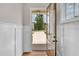 View from the front door showing a bright entryway with paneled walls and hardwood floors at 12912 Grey Willow Dr, Raleigh, NC 27613