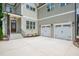 Well-manicured two story home featuring a two car garage and charming front door entrance at 12912 Grey Willow Dr, Raleigh, NC 27613