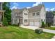 Charming two story home boasts a two car garage and well maintained front lawn at 12912 Grey Willow Dr, Raleigh, NC 27613