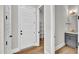 Hallway featuring walk-in pantry, half bath and storage at 12912 Grey Willow Dr, Raleigh, NC 27613
