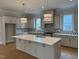 Spacious kitchen featuring an island, stainless steel appliances, and modern design at 12912 Grey Willow Dr, Raleigh, NC 27613