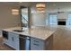 Contemporary kitchen with island, hardwood floors, and an open-concept design at 12912 Grey Willow Dr, Raleigh, NC 27613