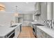 Modern kitchen with stainless steel appliances, custom cabinetry, an island, and tile backsplash at 12912 Grey Willow Dr, Raleigh, NC 27613