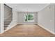Bright living room with hardwood floors, staircase, and ample space for entertaining at 12912 Grey Willow Dr, Raleigh, NC 27613