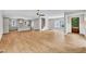Open floorplan showcasing hardwood floors, modern staircase, living room and kitchen areas at 12912 Grey Willow Dr, Raleigh, NC 27613