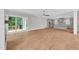 Open concept living room features an eat in kitchen, hardwood floors, and sliding glass doors at 12912 Grey Willow Dr, Raleigh, NC 27613
