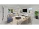 Inviting living room with large windows, modern furniture and decor, with a sleek design at 12912 Grey Willow Dr, Raleigh, NC 27613