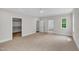 Spacious main bedroom features neutral carpet, ensuite bathroom access, and walk in closet at 12912 Grey Willow Dr, Raleigh, NC 27613