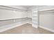 Spacious walk-in closet with custom shelving and ample storage for an organized wardrobe at 12912 Grey Willow Dr, Raleigh, NC 27613