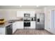 Modern kitchen with granite counters, stainless steel appliances, and ample storage space at 135 Holmes Corner Dr, Smithfield, NC 27577