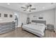 Spacious bedroom with hardwood floors, contemporary decor, and a well-lit ensuite bathroom at 173 E Wilson St, Clayton, NC 27520