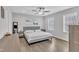 Bright bedroom with a ceiling fan, wood-look floors, and modern furniture at 173 E Wilson St, Clayton, NC 27520
