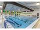 Bright indoor pool with marked lanes for swimming and overhead lighting at 173 E Wilson St, Clayton, NC 27520