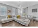 Bright living room with modern furniture, stylish lighting, and access to the foyer at 173 E Wilson St, Clayton, NC 27520