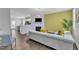 Open-concept living area showcasing modern decor, a comfortable sofa, and access to the kitchen at 173 E Wilson St, Clayton, NC 27520