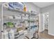 Organized walk-in pantry featuring wire shelving, with lots of storage for food and household items at 173 E Wilson St, Clayton, NC 27520