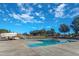 Relaxing outdoor pool with a fun waterslide and deck with shaded trees at 173 E Wilson St, Clayton, NC 27520