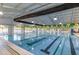 Bright indoor pool with swimming lanes, high ceilings, and ample natural light streaming through large windows at 173 E Wilson St, Clayton, NC 27520