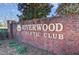 Brick sign for Riverwood Athletic Club with beautiful plants and foliage at 173 E Wilson St, Clayton, NC 27520