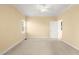 Neutral bedroom with large window and carpeted flooring at 2 Poplar Ave, Elon, NC 27244