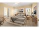 Serene bedroom featuring hardwood floors, ample natural light, and neutral decor at 2 Poplar Ave, Elon, NC 27244