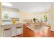 Inviting dining area featuring hardwood floors, a stylish light fixture, and comfortable seating at 2 Poplar Ave, Elon, NC 27244