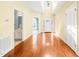 Bright foyer with hardwood floors, high ceilings, and an abundance of natural light at 2 Poplar Ave, Elon, NC 27244